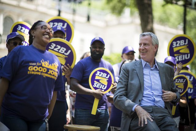 Mayor Bill de Blasio at a press conference in June where he announced that the city will commit $40.5 million in the city budget raise city-contracted shelter security guards' wages to meet the prevailing wage rate for security guards.